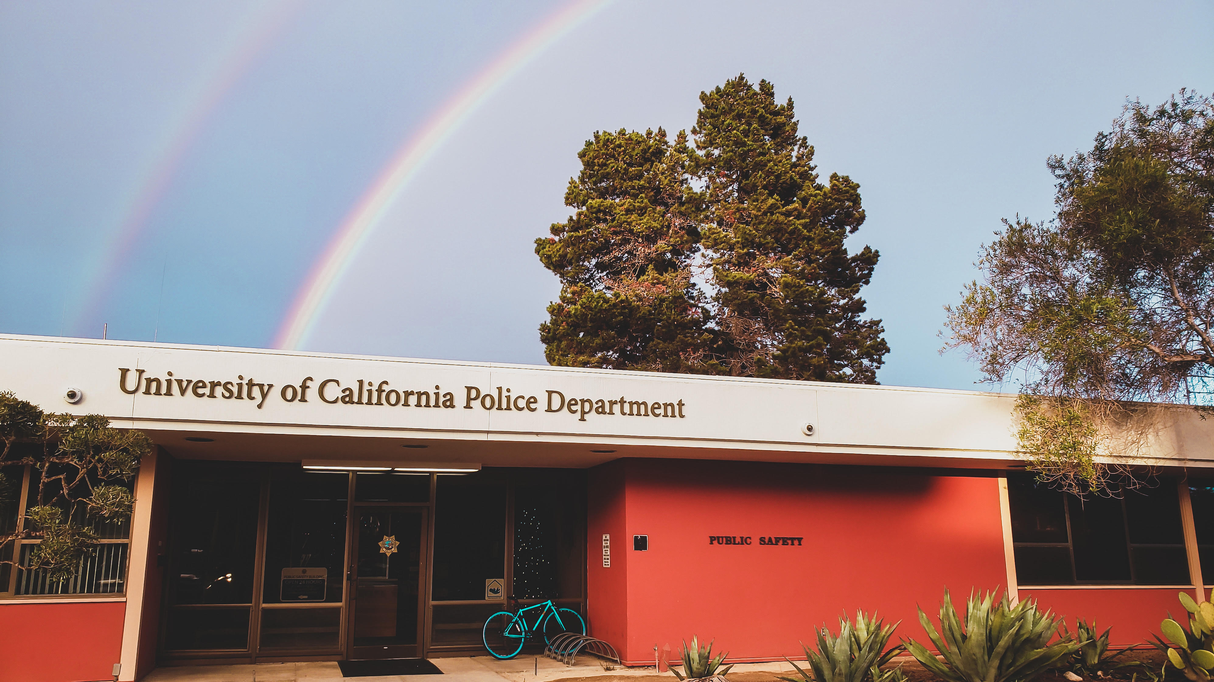 UCSB Police Station with rainbow in background 